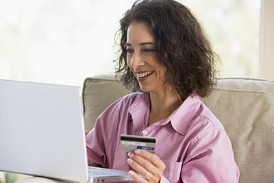 High risk merchant account holder at a computer